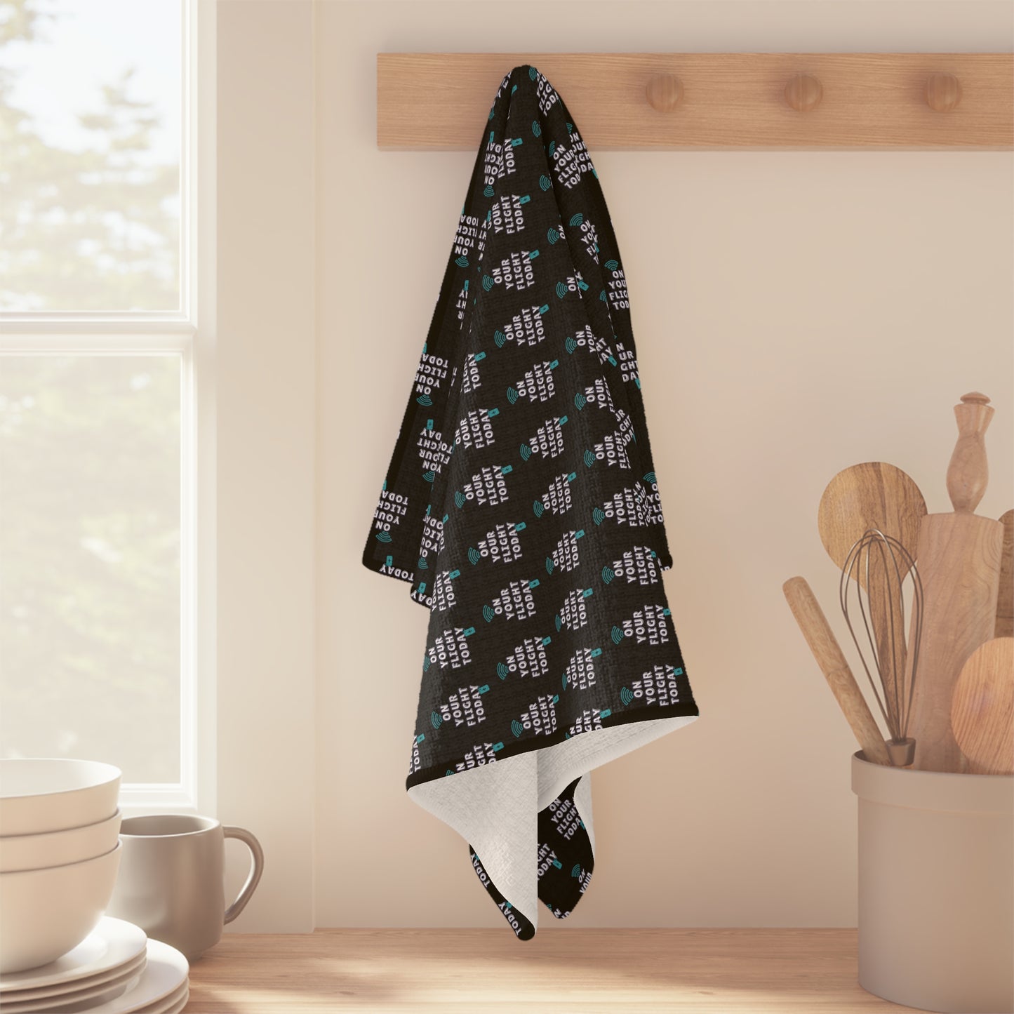 OYFT Tea Towel hanging up on kitchen rack.