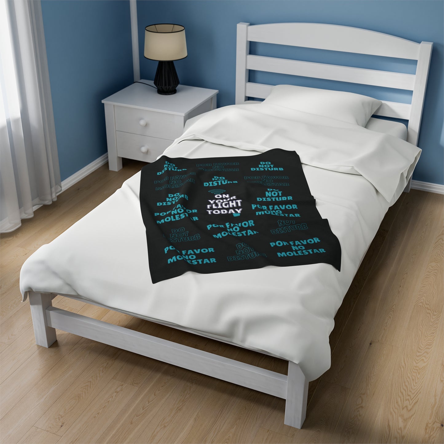 Small blanket on single bed. 