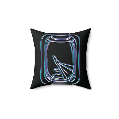 Back of pillow showing outline of airplane window and view of aircraft wing. 