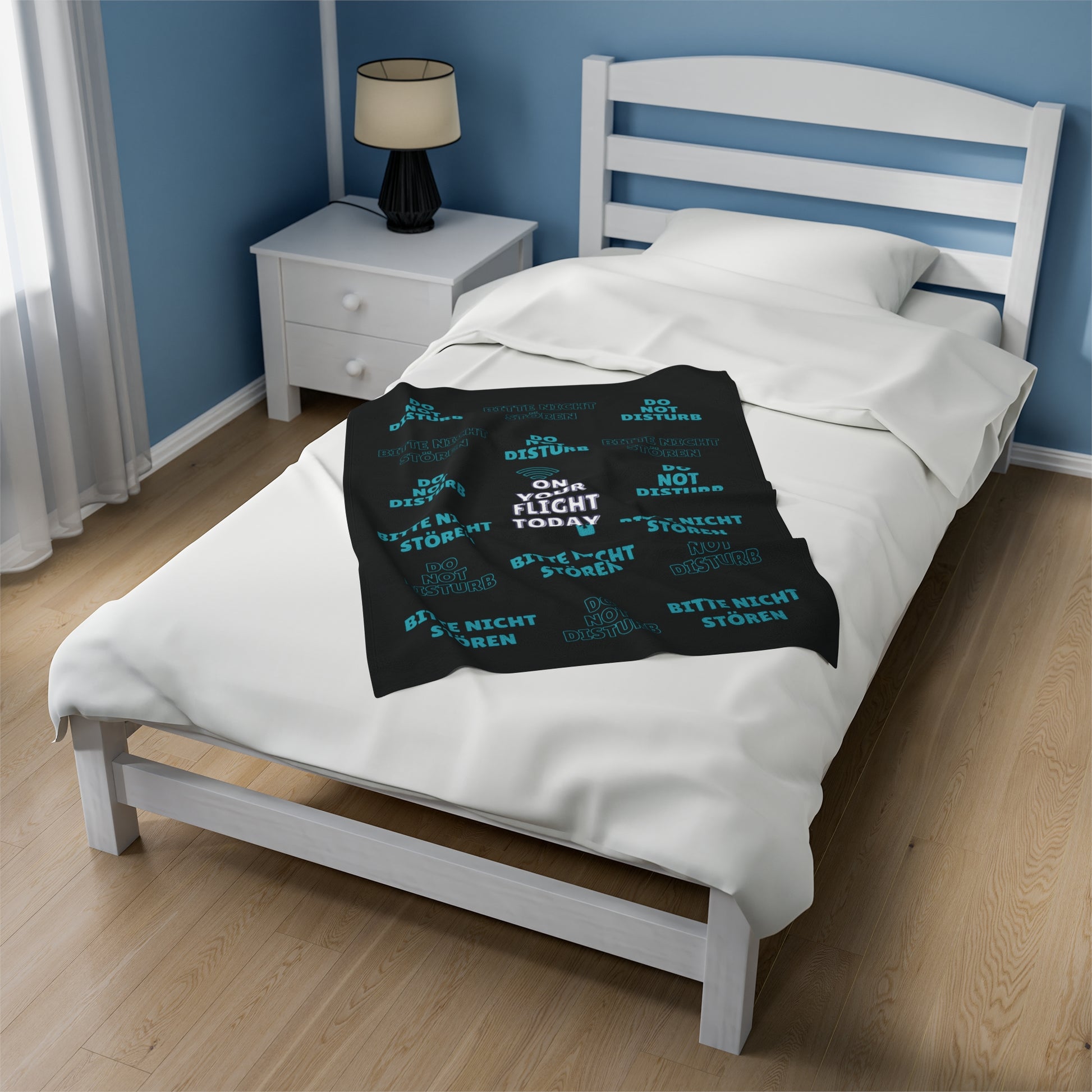 Small blanket on single bed. 