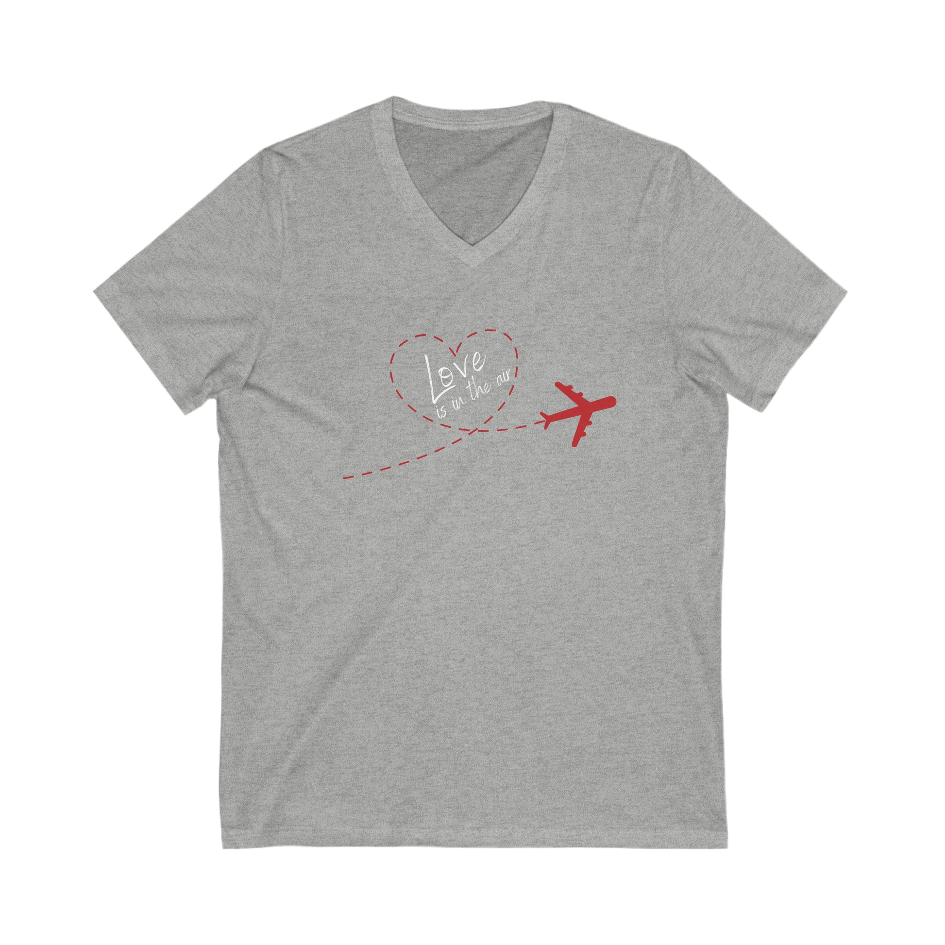 Gray tee with red plain that has a trail that forms the shape of a heart. Within the heart is the text 'Love is in the air'. 