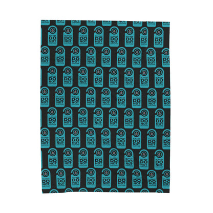Black blanket with a repeated image of a door do not disturb tag with text 'Please do not disturb' in green and the OYFT logo where the door knob would be. 