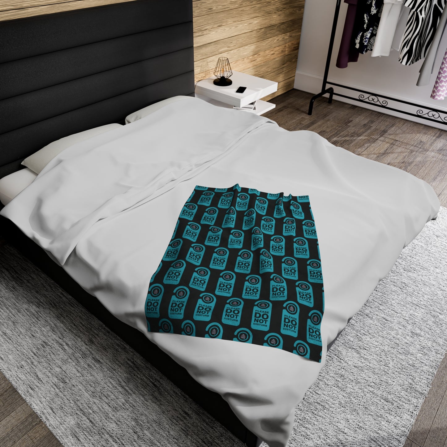 Smaller blanket on double bed. 